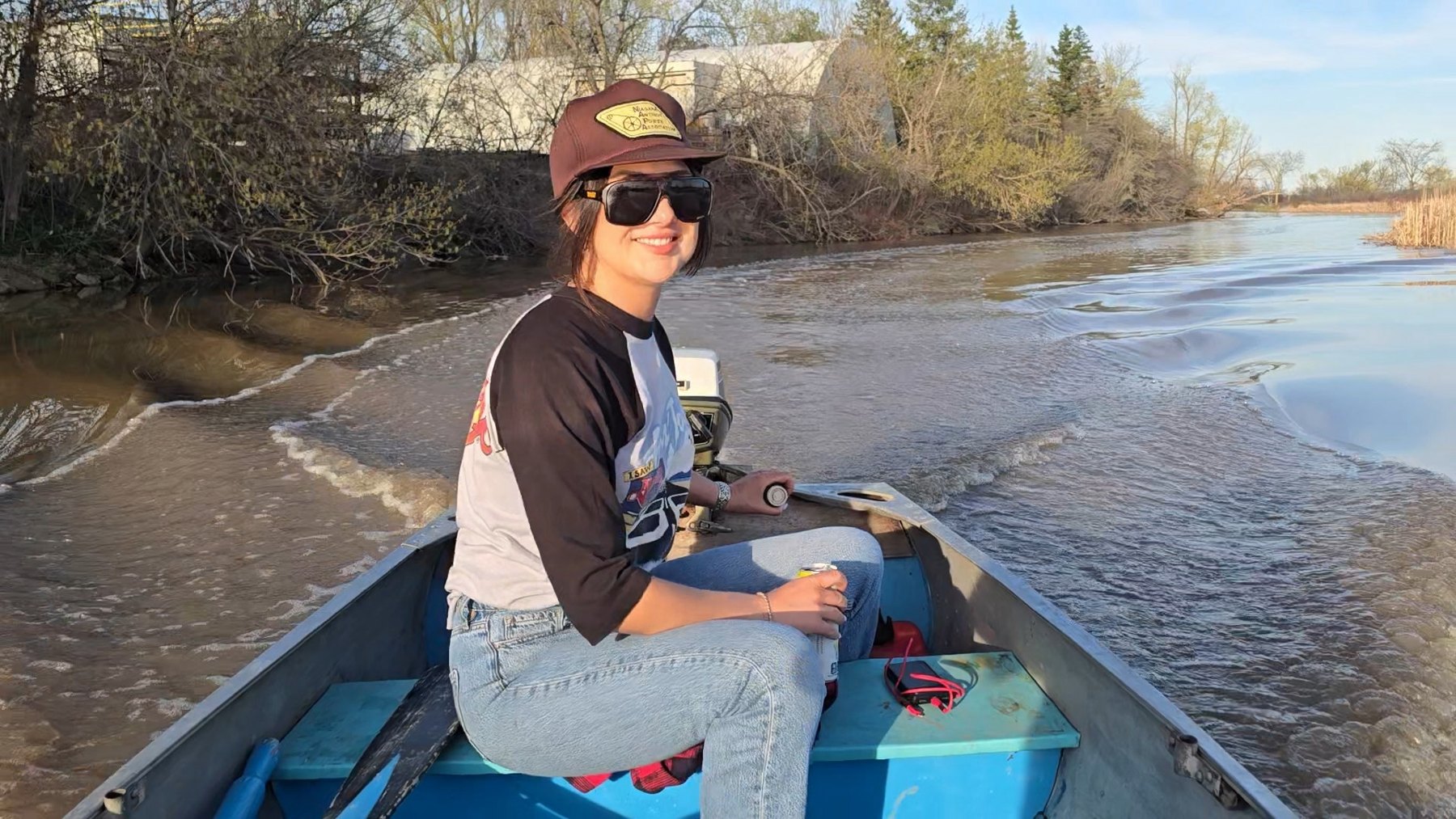 Nelly on her boat on the river